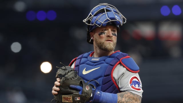 Chicago Cubs catcher Tucker Barnhart looks in to his dugout between batters.
